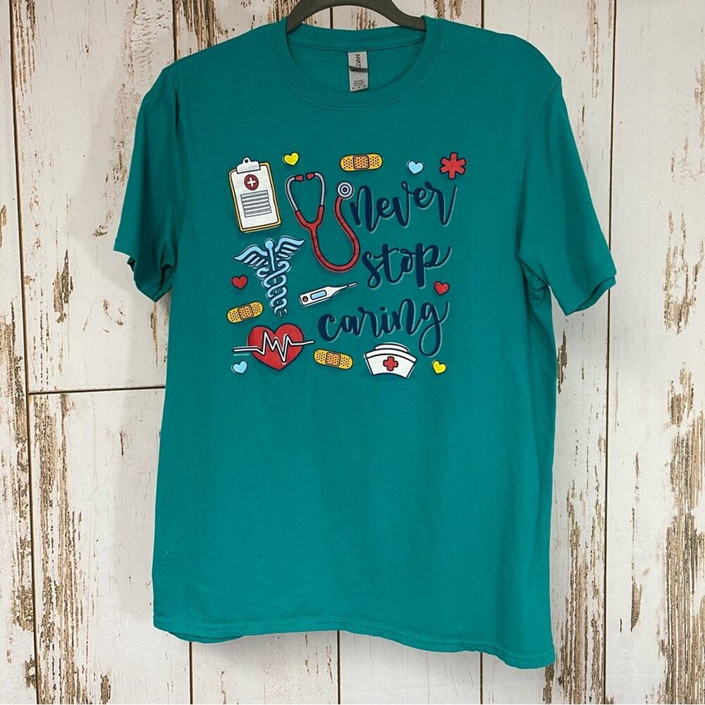 Gildan, Never Stop Caring Nursing Graphic T-Shirt. Size Medium. Excellent cond!